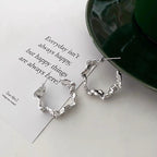The Fluid Form Sculptural Hoop Earrings