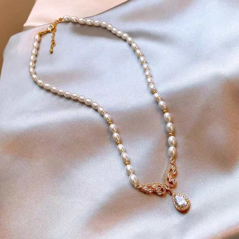Elegant Baroque Pearl & Cubic Zirconia Winged Statement Necklace – Gold-Tone Bridal Jewelry