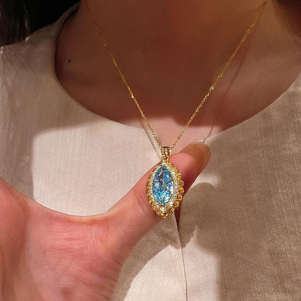 Vintage-Inspired Marquise Blue Topaz and Diamond Halo Pendant Necklace