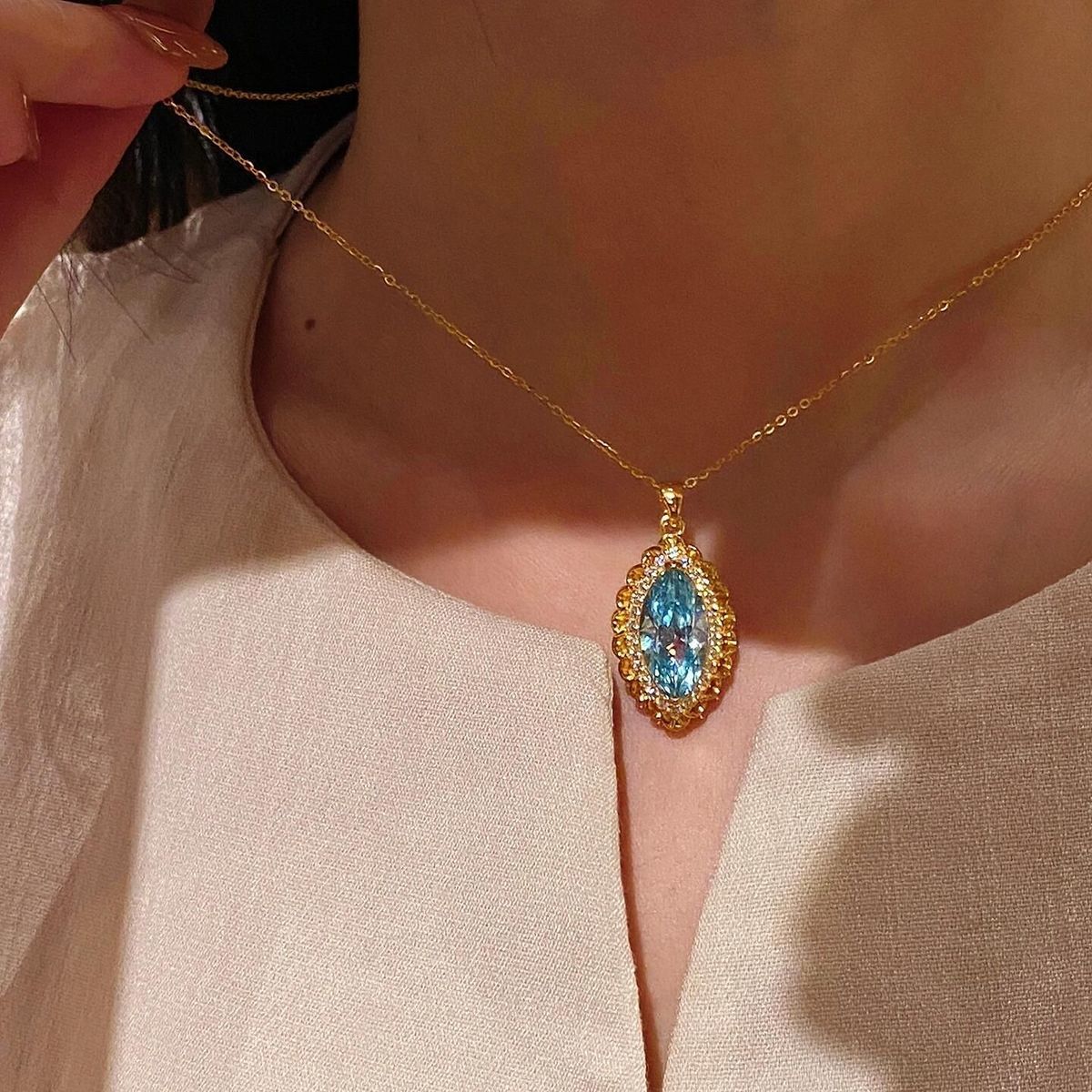Vintage-Inspired Marquise Blue Topaz and Diamond Halo Pendant Necklace