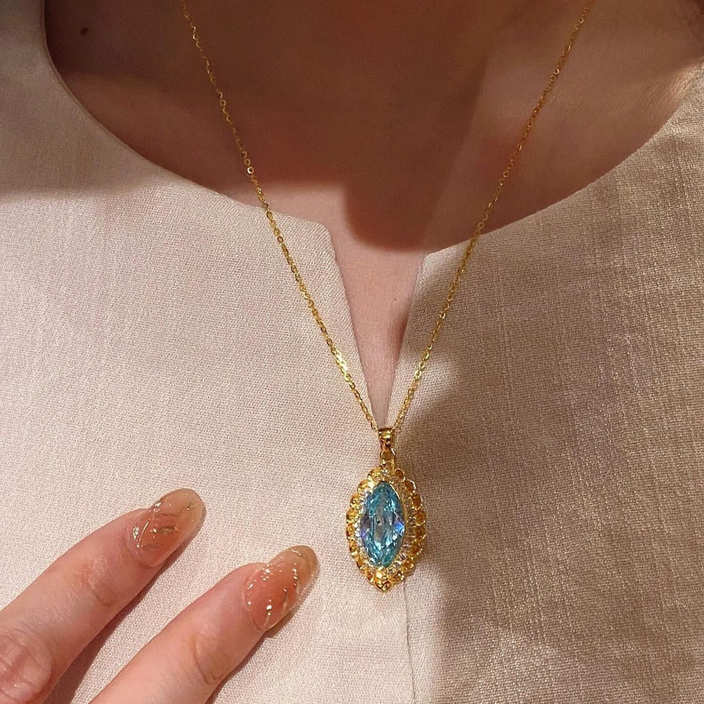 Vintage-Inspired Marquise Blue Topaz and Diamond Halo Pendant Necklace