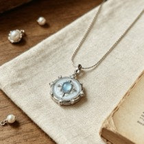 Vintage-Inspired Sterling Silver Oval Blue Star Sapphire and Mother of Pearl Locket Pendant Necklace